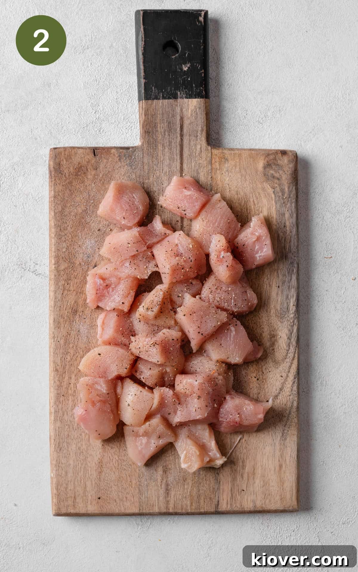 Crispy Salt and Pepper Chicken Recipe for Perfect Weeknight Dinner 5 chicken pieces on a cutting board.