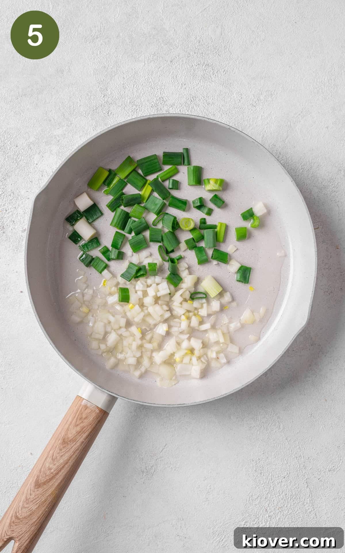 Crispy Salt and Pepper Chicken Recipe for Perfect Weeknight Dinner 8 onion and spring onion in a skillet.