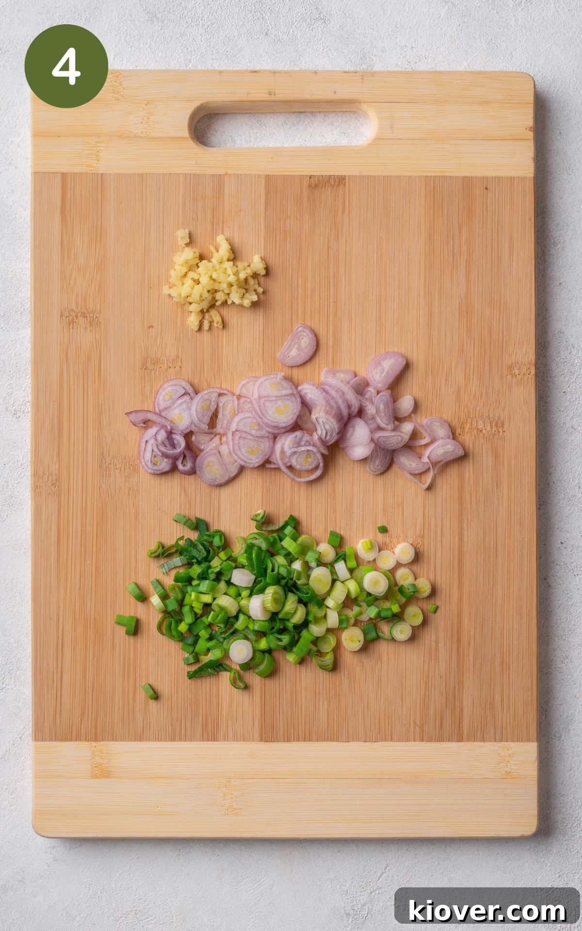 Creamy Chicken and Sweetcorn Soup Recipe for Cozy Weeknights 7 shallots, spring onion and ginger on a cutting board.