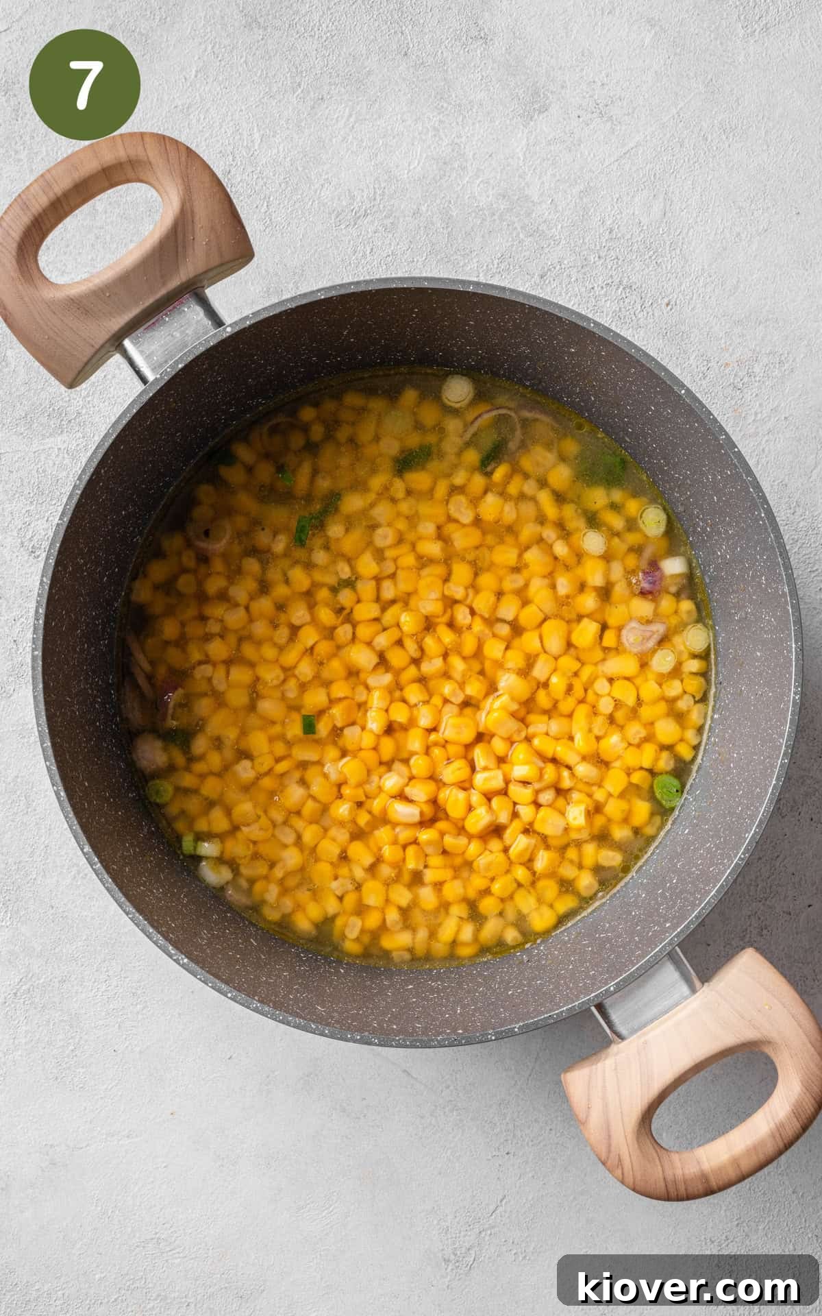 Creamy Chicken and Sweetcorn Soup Recipe for Cozy Weeknights 10 adding corn to the saucepot.