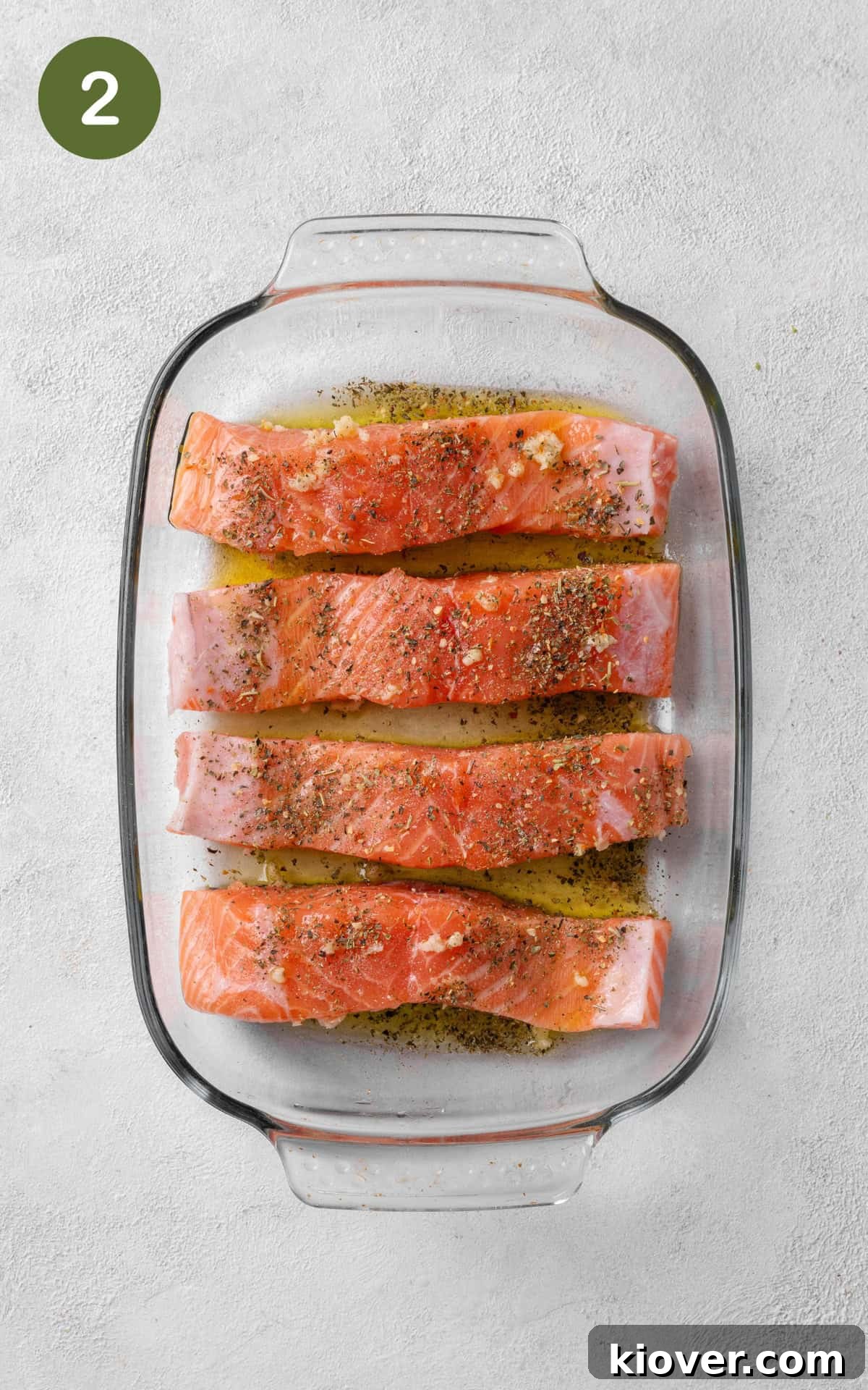 Flavorful Salmon Tray Bake with Lemon, Garlic, and Roasted Veggies 5 salmon marinated with herbs and olive oil.