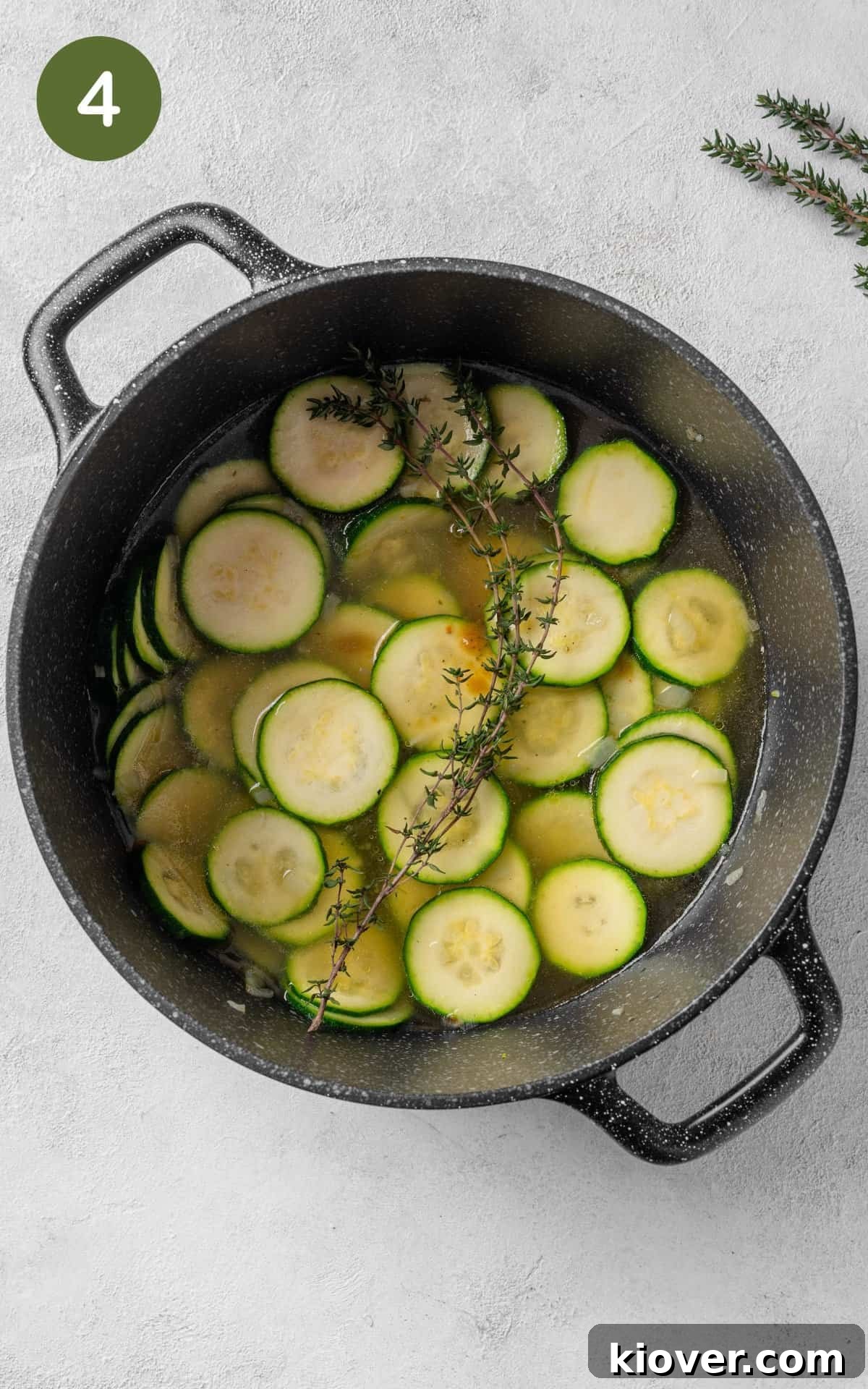 Courgette and spices in a saucepan.