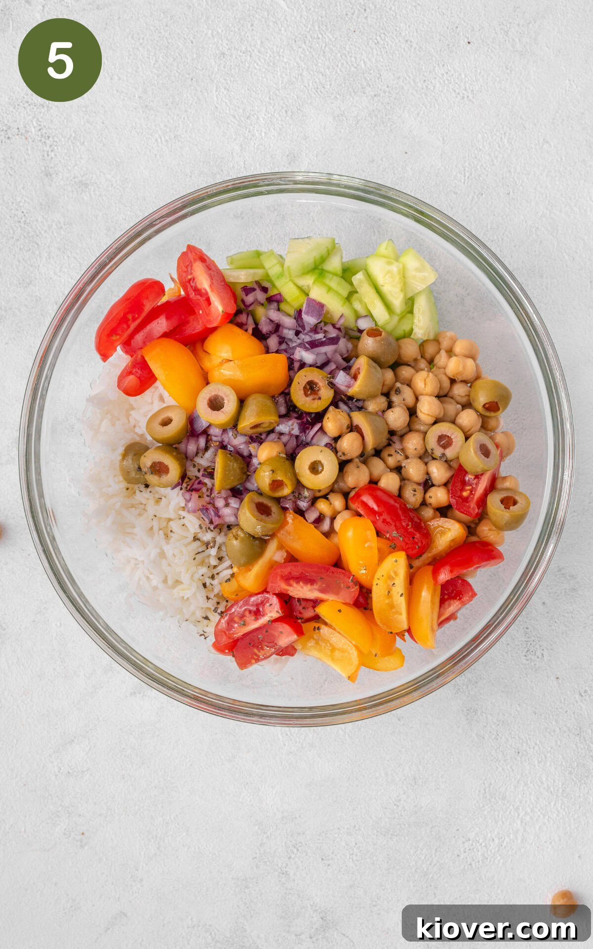 Rice salad ingredients in a bowl.