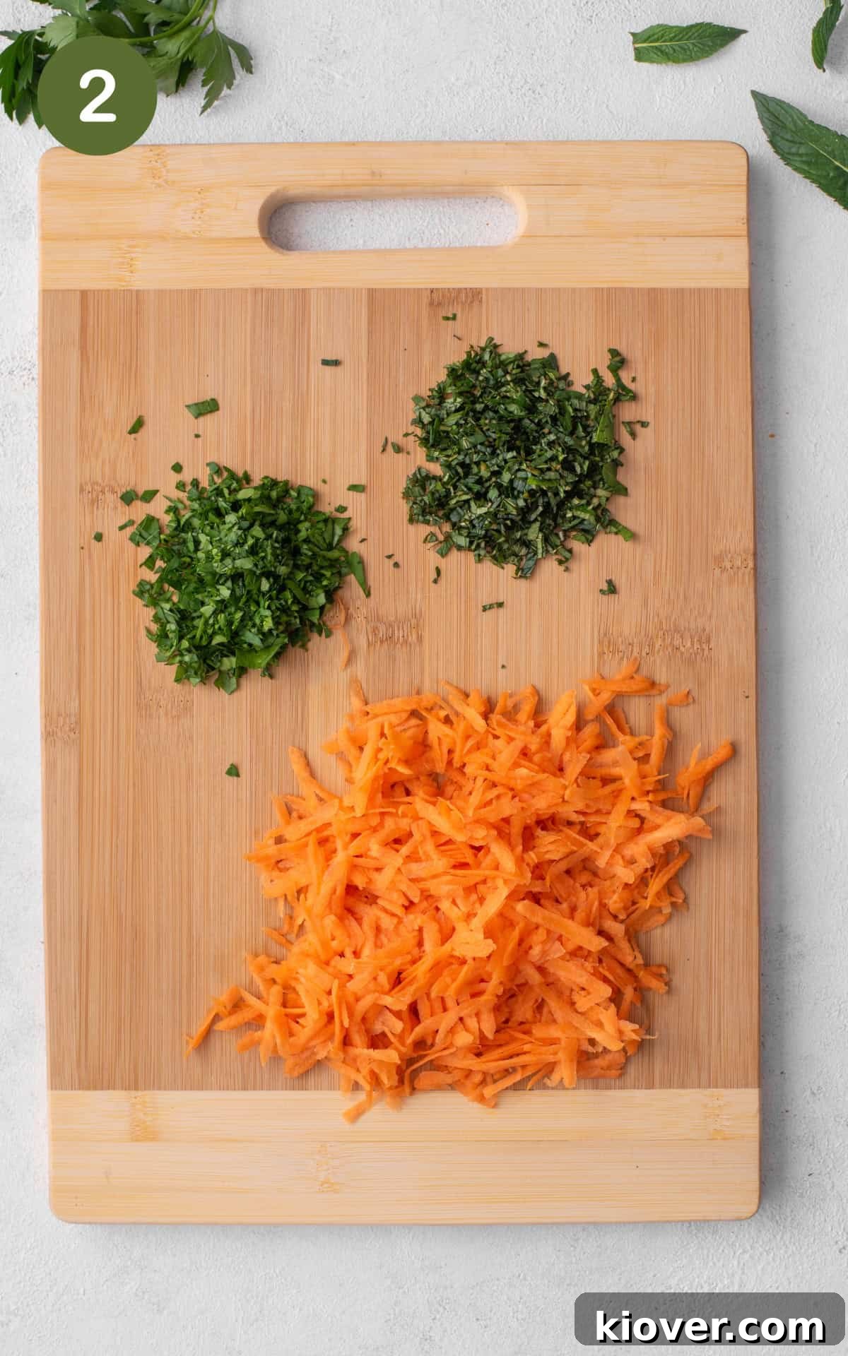 Shredded vegetables on a cutting board.