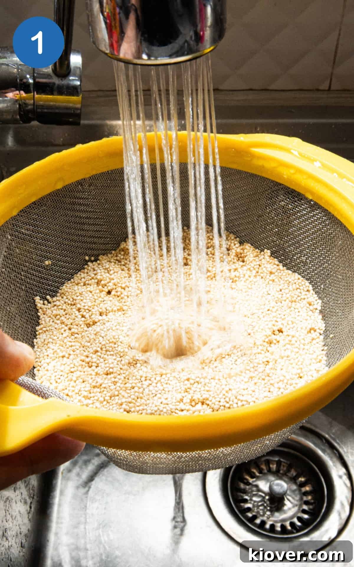 rinsing the quinoa in a sieve with water.