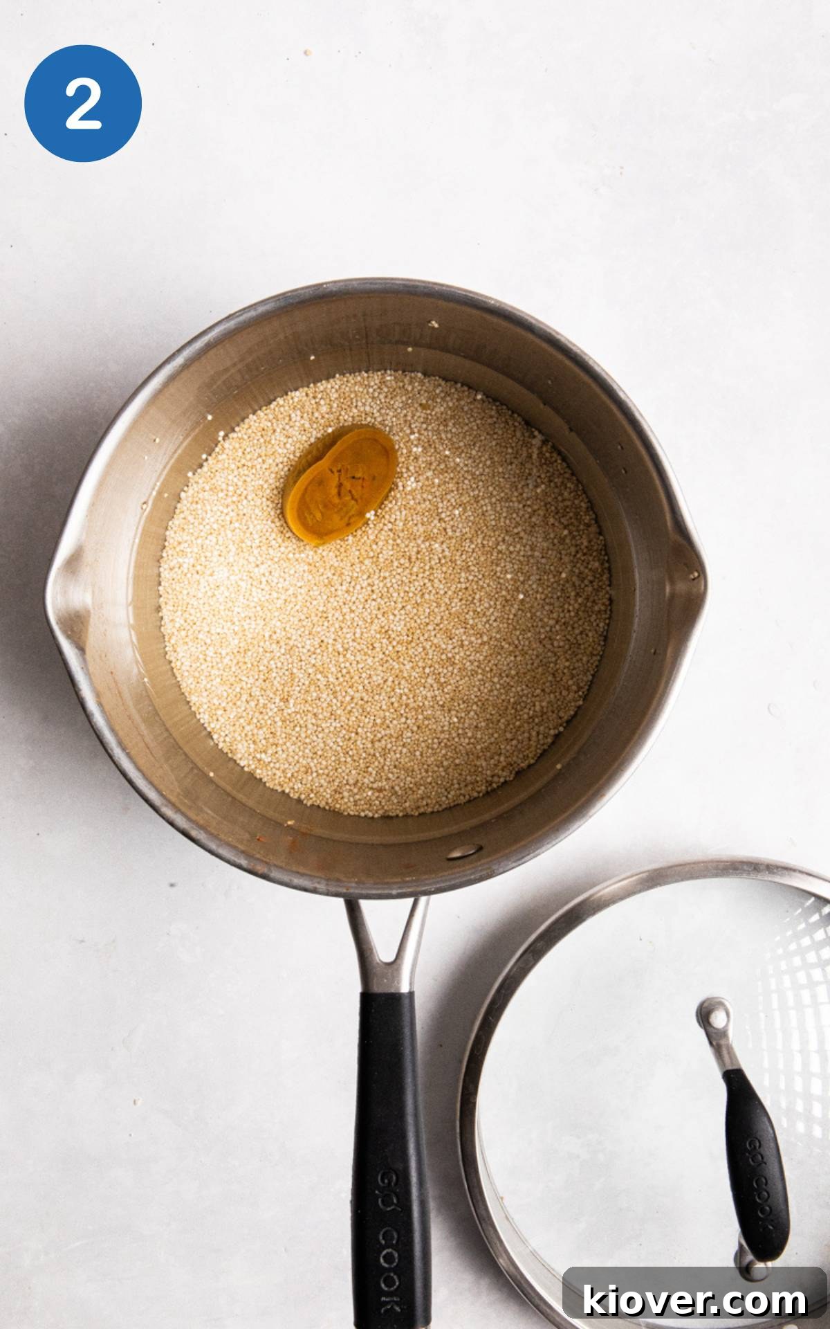 quinoa in a pot with a stock pot/cube.