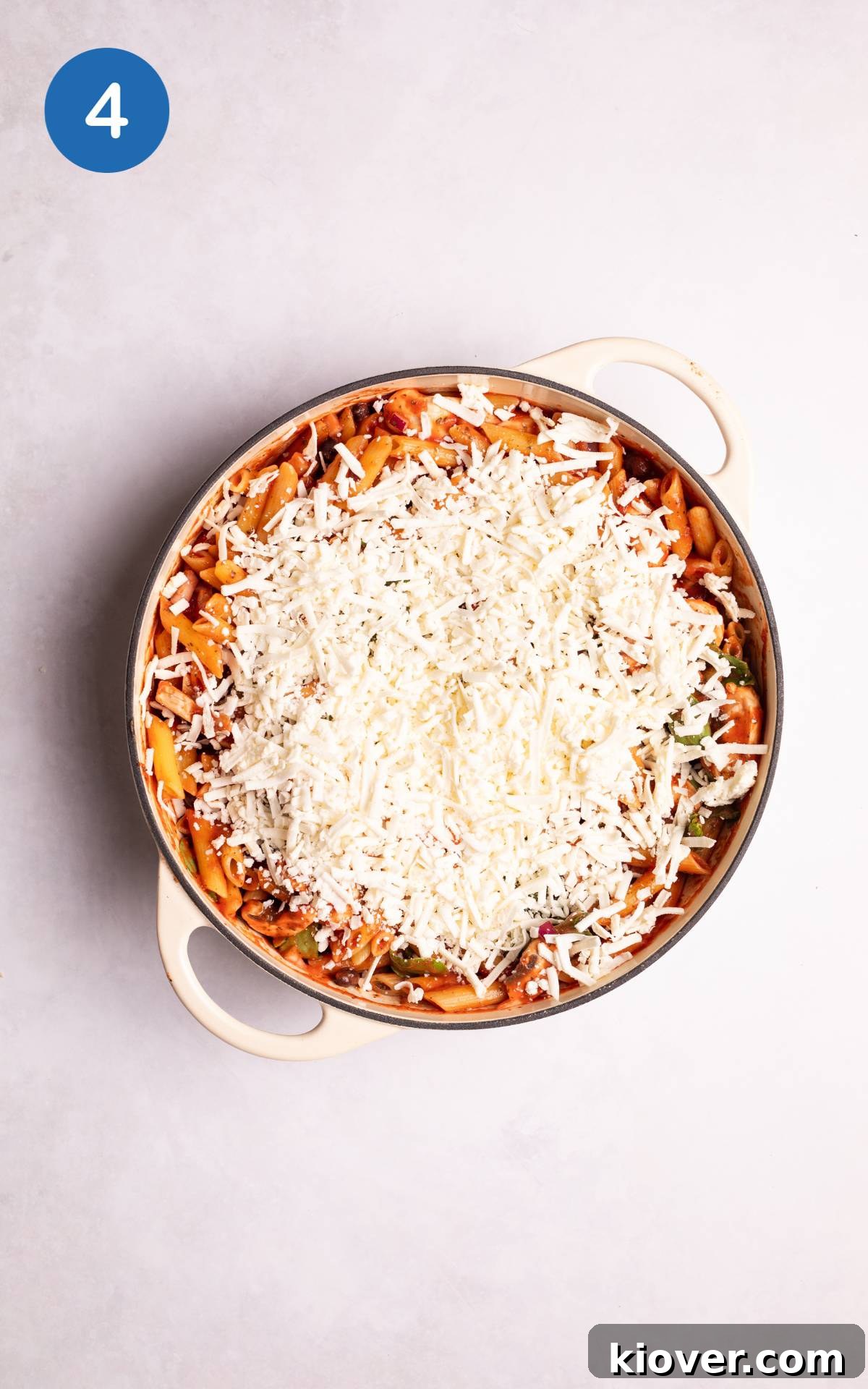 Vegan Pasta Bake with grated cheese on top.