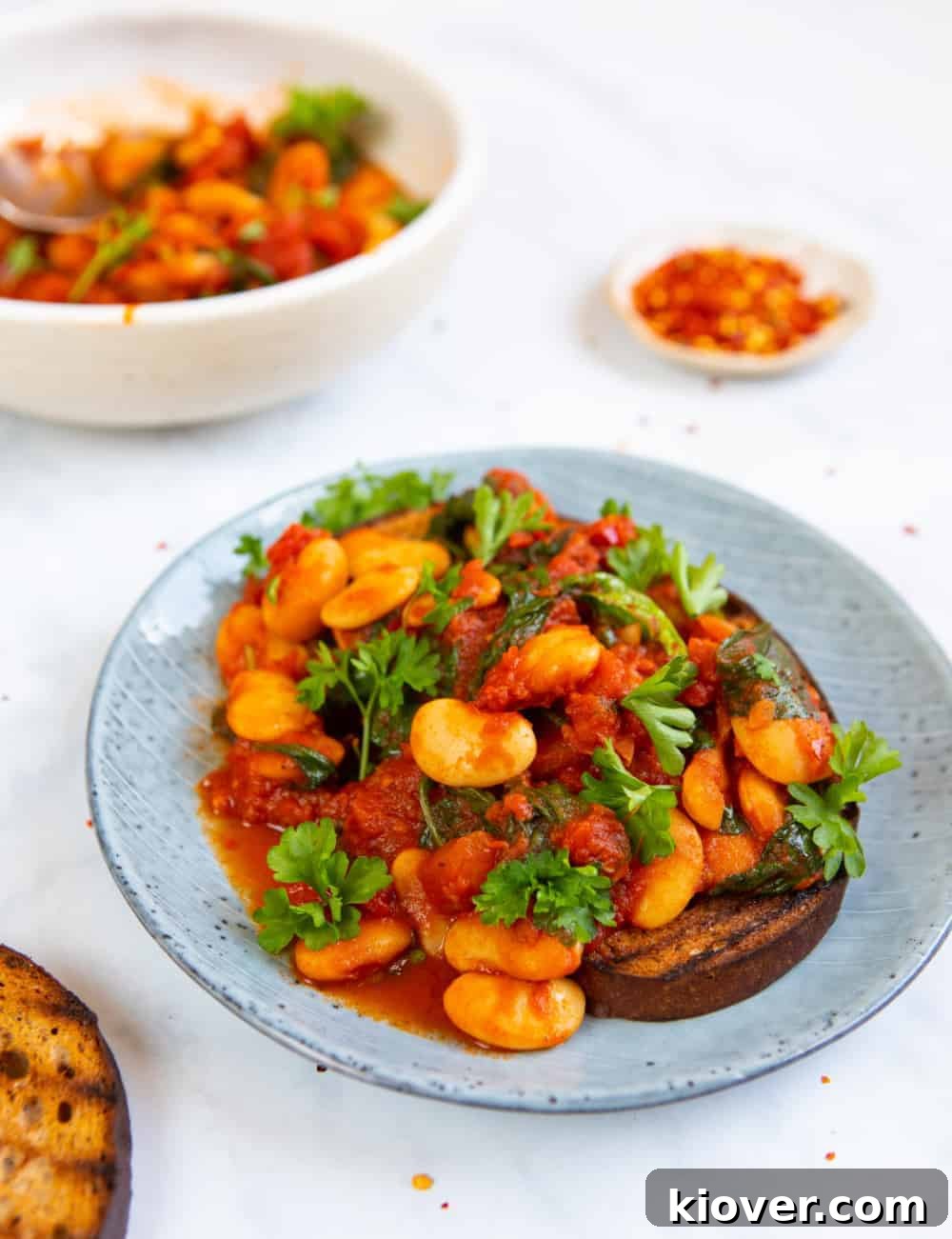 Spicy Butter Beans Recipe: Flavorful One-Pot Side Dish 2 Spicy Butterbeans on Toast close up.