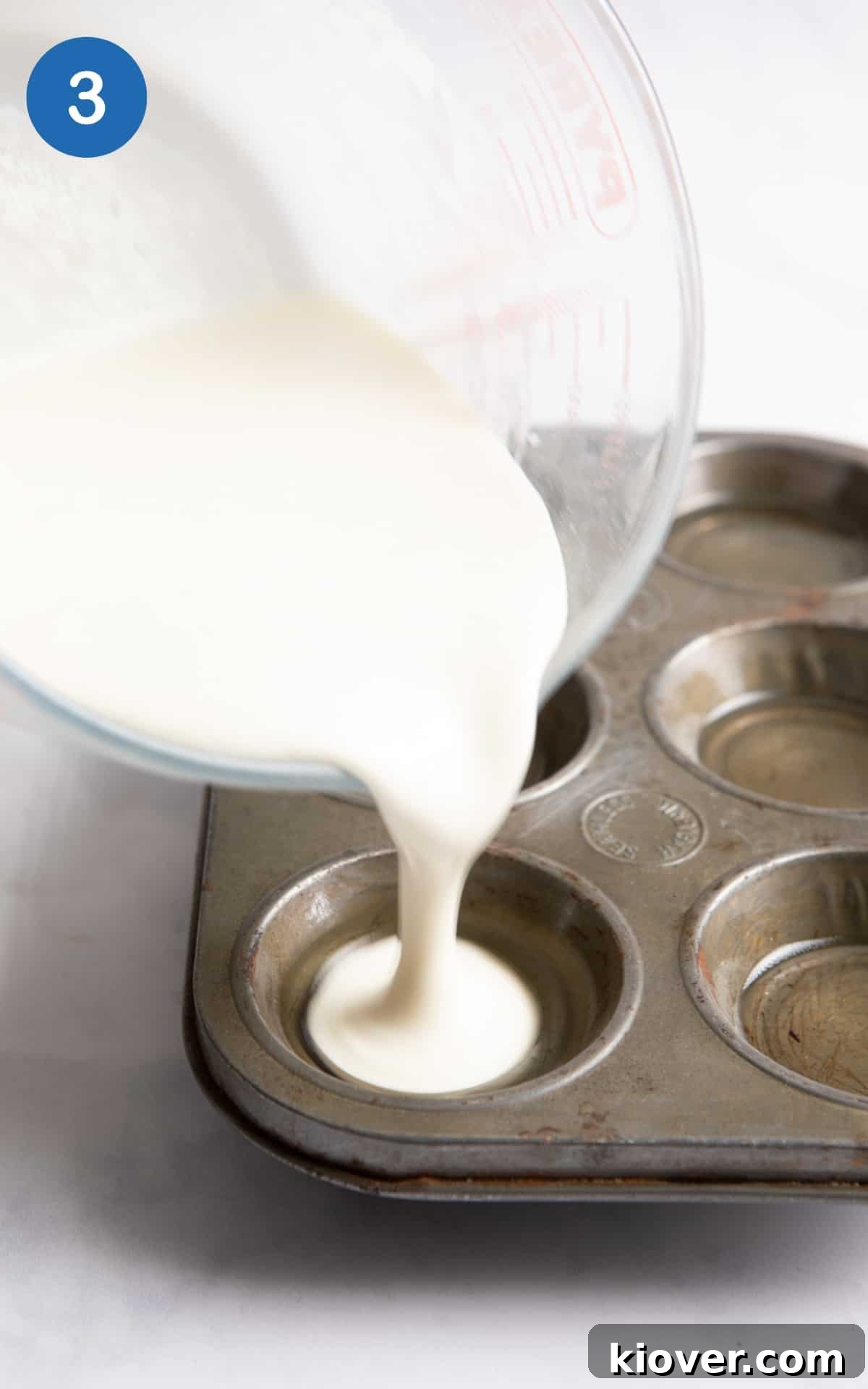 Gluten-Free Vegan Yorkshire Puddings Recipe 6 batter being poured into muffin baking tray.