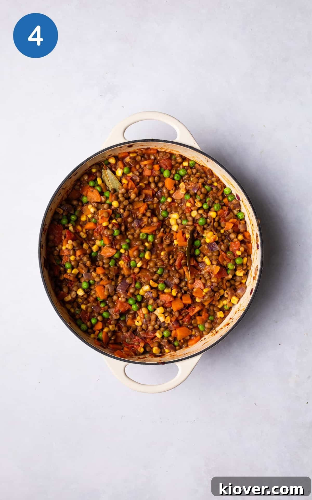 Hearty Lentil Cottage Pie Recipe for Comforting Weeknight Dinners 6 adding more vegetables in the pot.