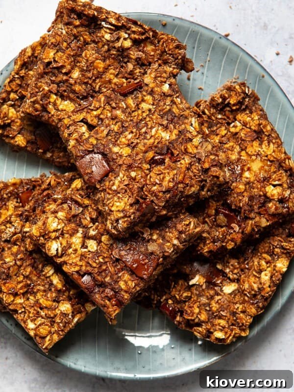 chocolate flapjacks sliced into squares served on a blue plate.