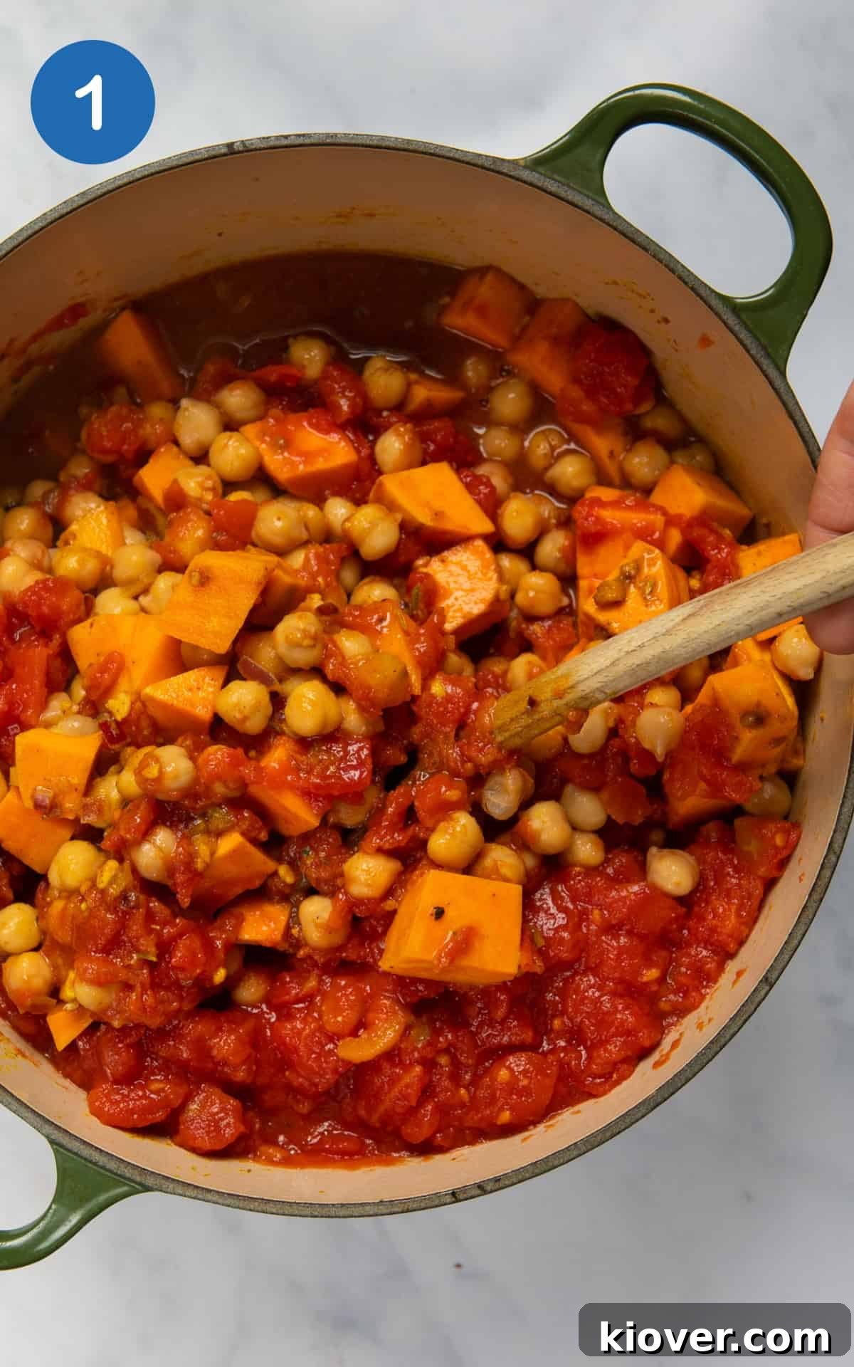 Creamy African Peanut Stew with Sweet Potatoes and Spinach 4 Sweet potato and seasonings combined in a pot.