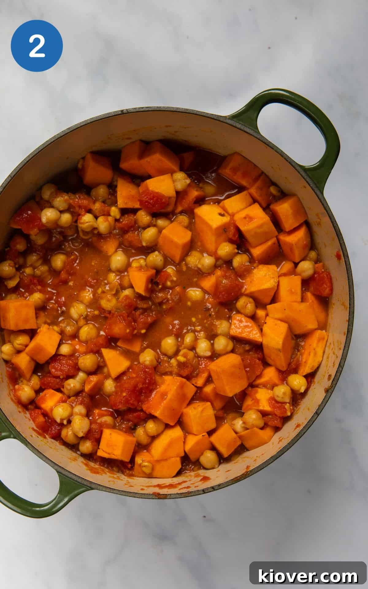 Creamy African Peanut Stew with Sweet Potatoes and Spinach 5 Sweet potato, chickpeas and peanut butter in a pot mixed with tinned tomatoes.