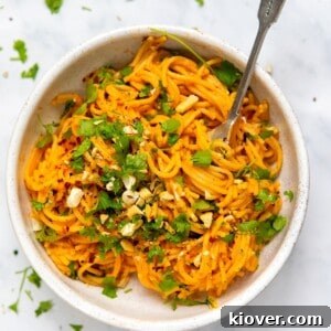 Creamy Roasted Red Pepper Pasta Recipe for Dinner Tonight 9 Red Pepper Pasta served in a white bowl with a metal fork