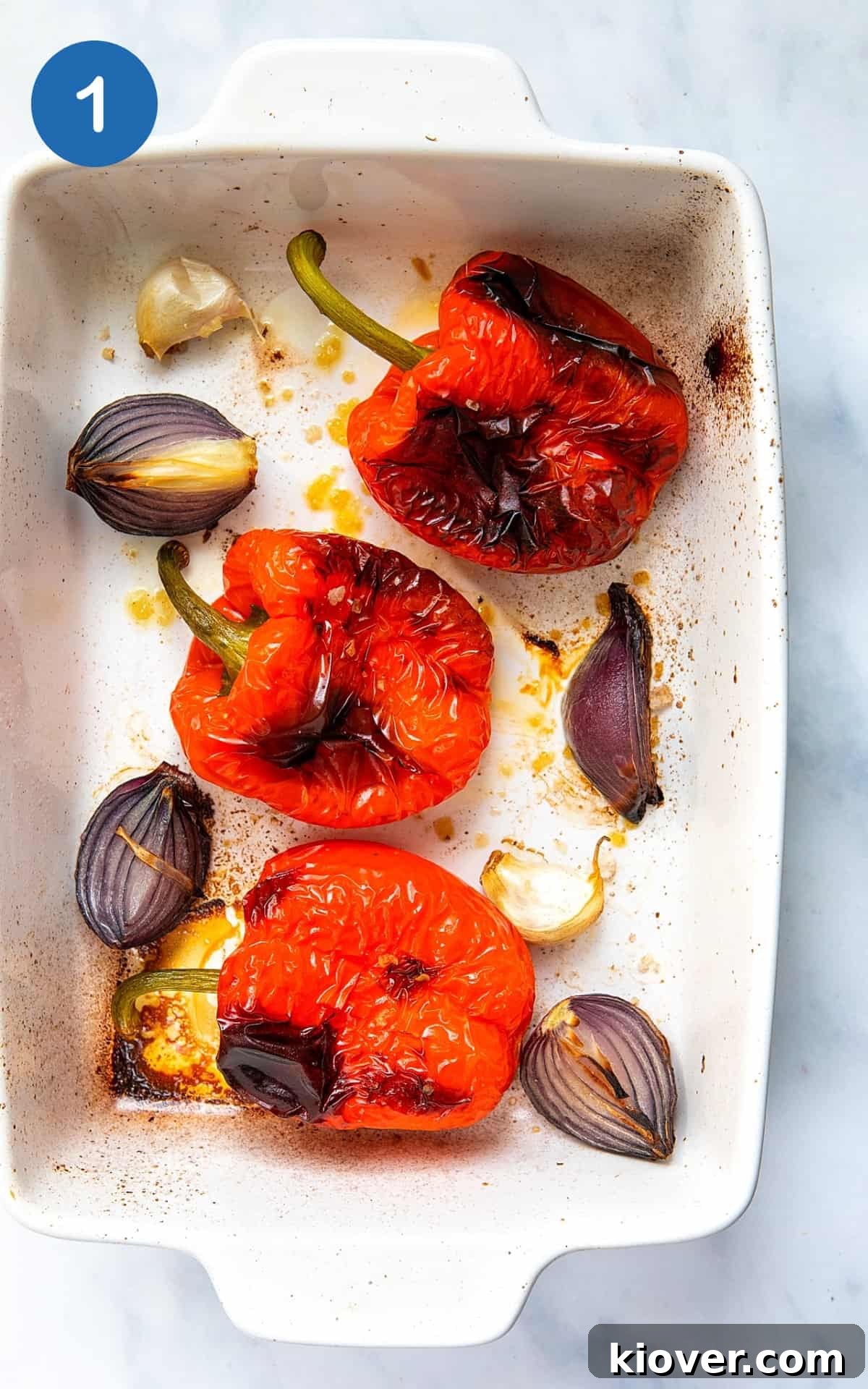 Creamy Roasted Red Pepper Pasta Recipe for Dinner Tonight 4 roasted pepper, garlic and onion in a roasting dish.