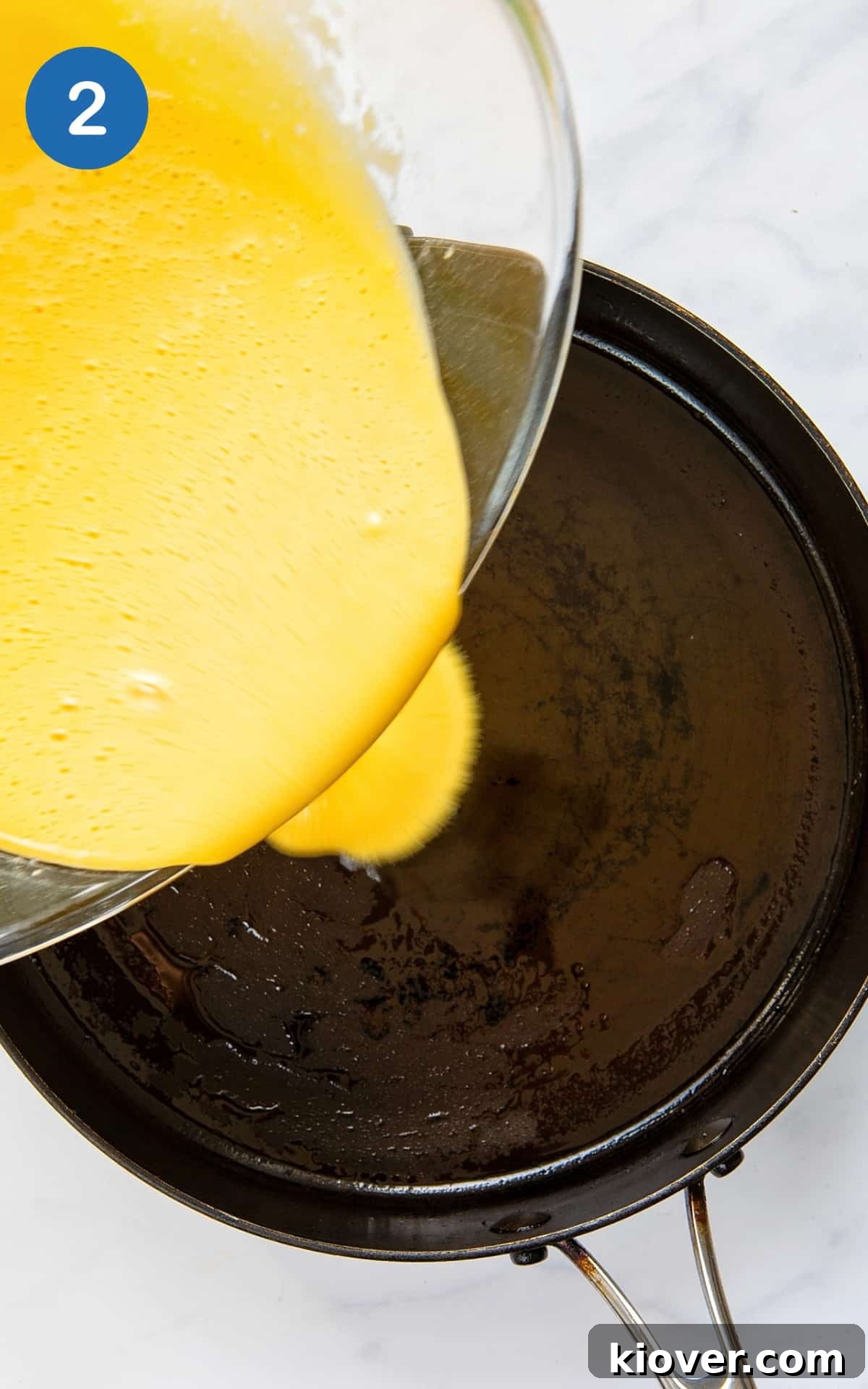 Gluten free pizza mixture being poured into a pan.