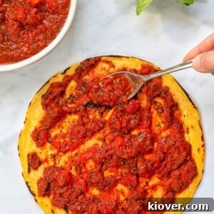 pizza sauce topped on a pizza base