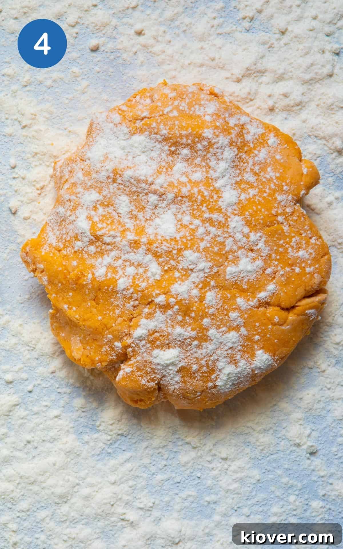 Sweet Potato Gnocchi Recipe: Light, Fluffy & Flavorful 7 dough laid out on white surface with flour.