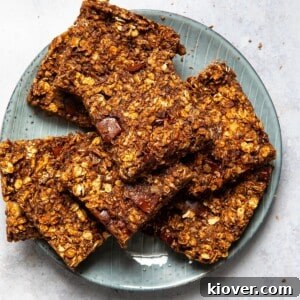 chocolate flapjacks sliced into squares served on a blue plate.