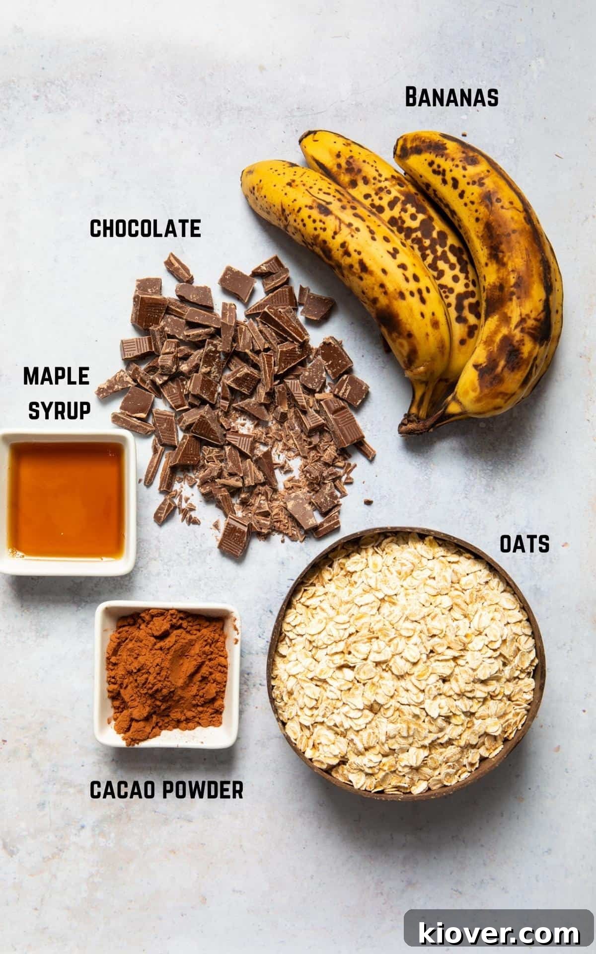 ingredients to make flapjacks laid out on white background.