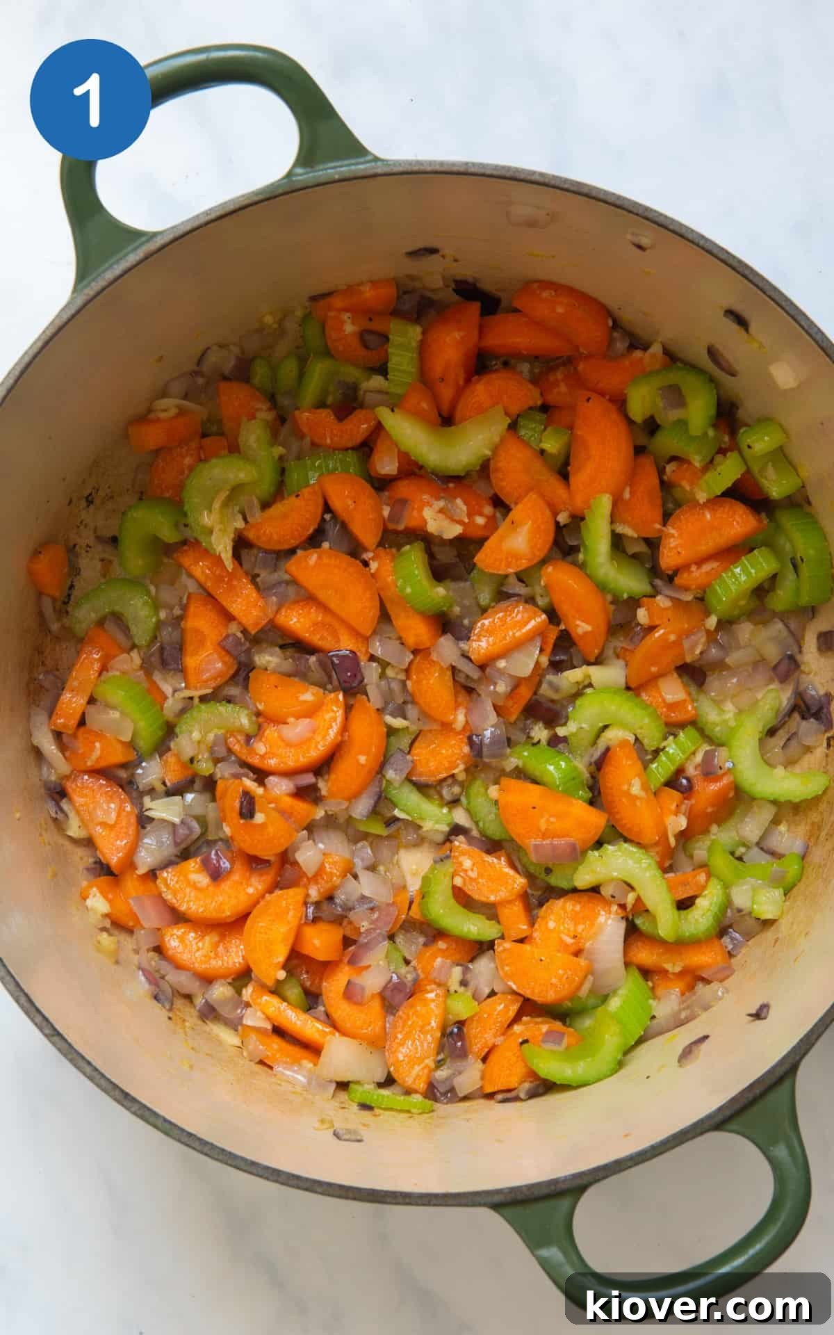 onion, garlic, carrots and celery frying in a large pot.