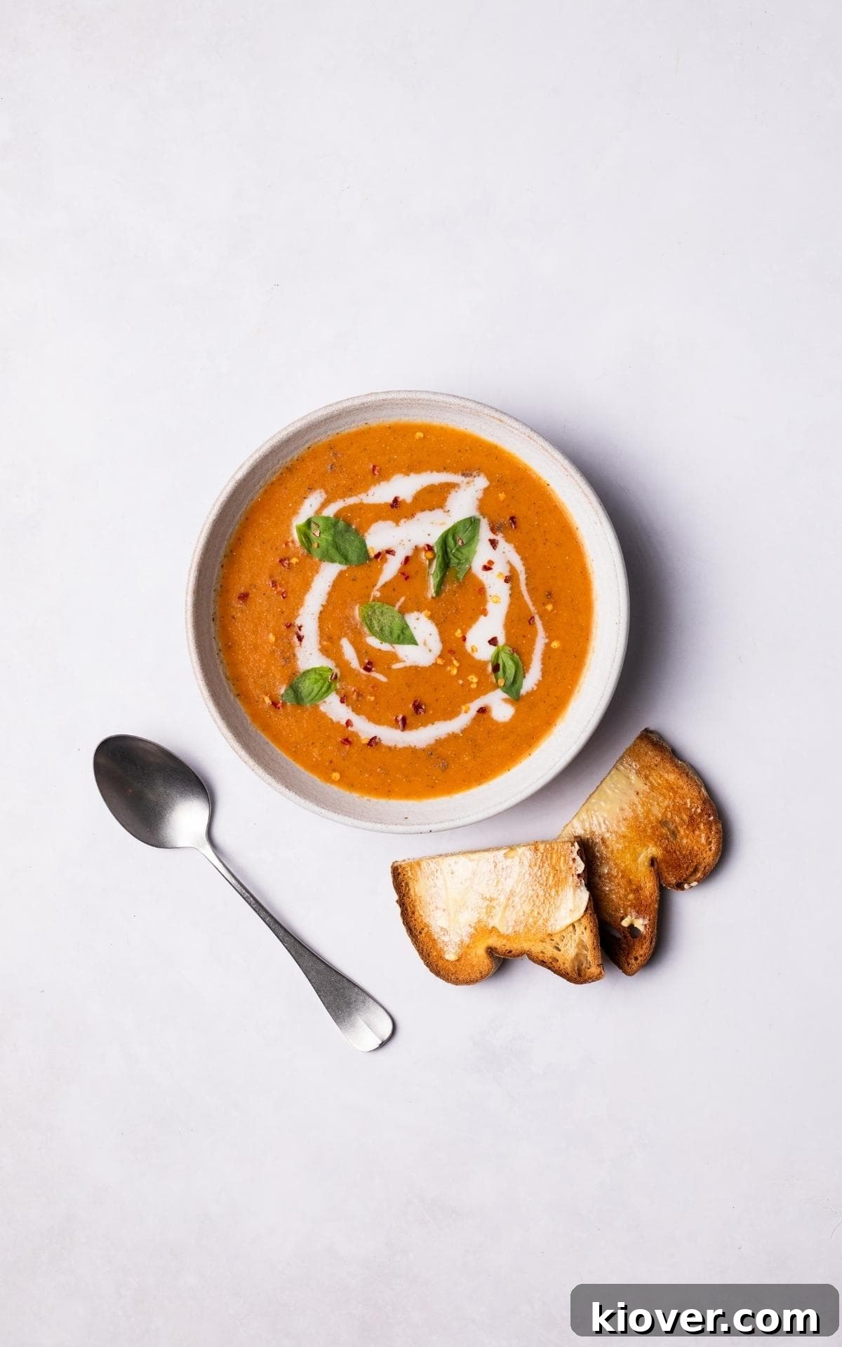 Roasted Tomato Soup served with a slice of toast.