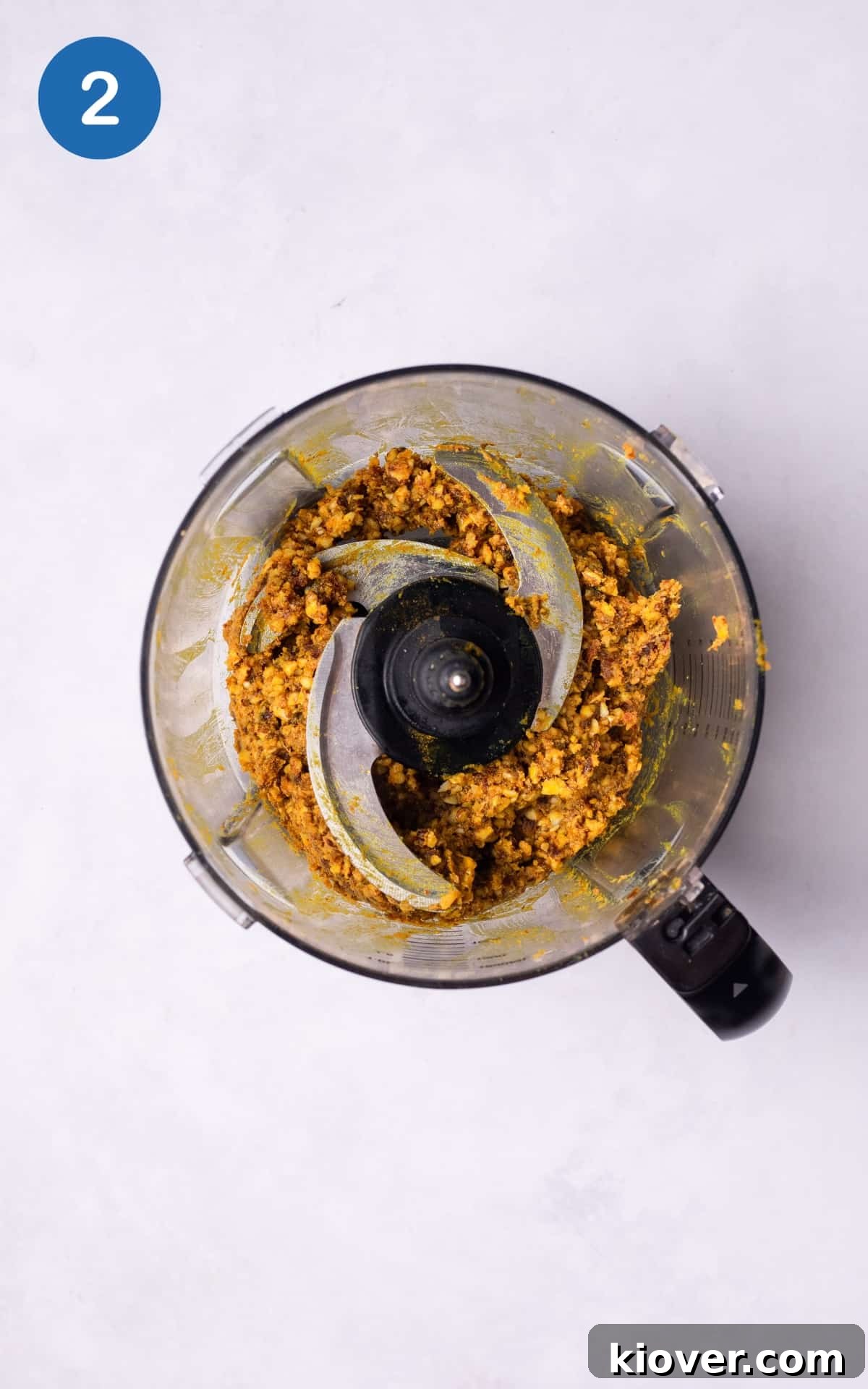 Protein-Packed Energy Bites for Lasting Fuel 5 adding water to the mixture in food processor.