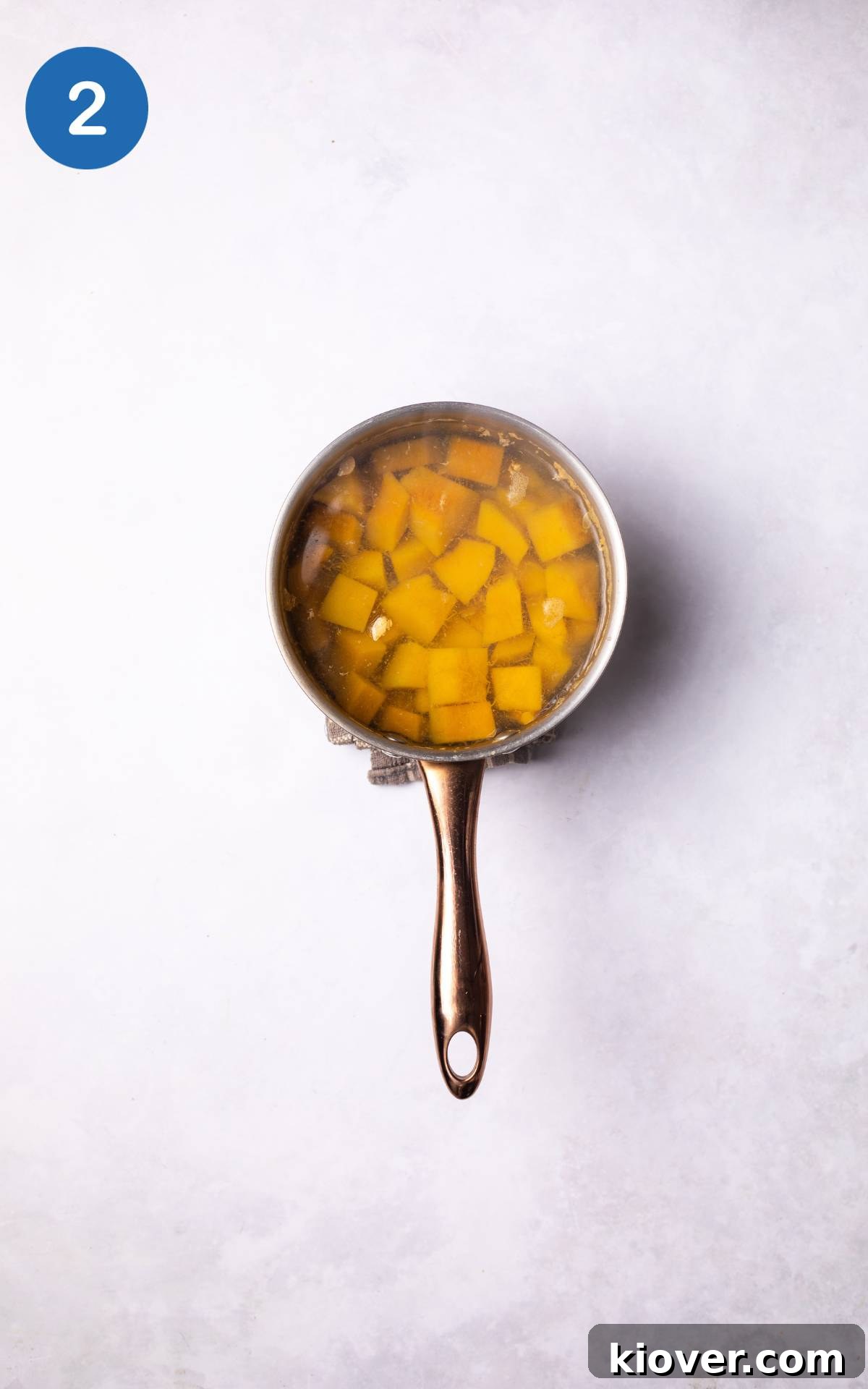 Pumpkin in a pot, covered with water.