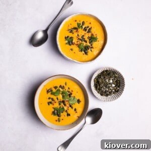Creamy Pumpkin & Butternut Soup Recipe for Fall Comfort 12 Pumpkin and Butternut Soup served in two white bowls.