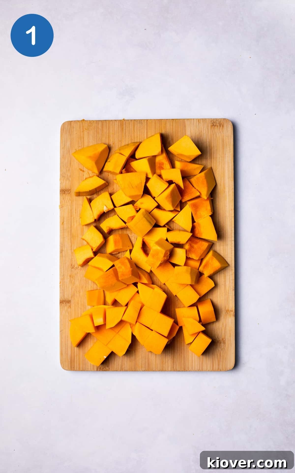 Creamy Pumpkin & Butternut Soup Recipe for Fall Comfort 4 Pumpkin and Butternut Squash sliced in small cubes on a chopping board.