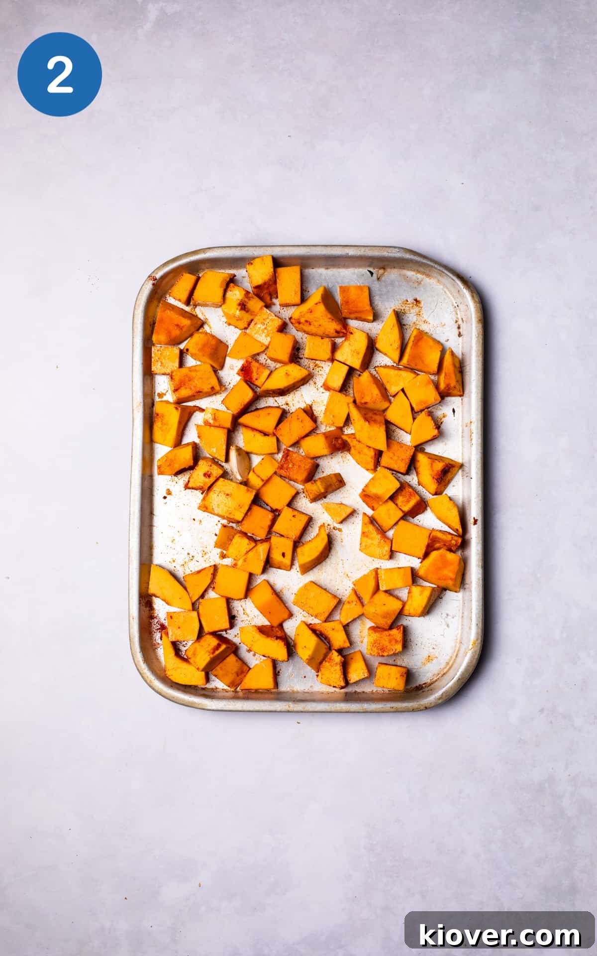 Creamy Pumpkin & Butternut Soup Recipe for Fall Comfort 5 Pumpkin and Butternut Squash cubes on a baking tray.