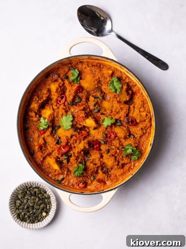 Creamy Pumpkin & Butternut Soup Recipe for Fall Comfort 8 Pumpkin Curry with Quinoa served in a casserole dish.