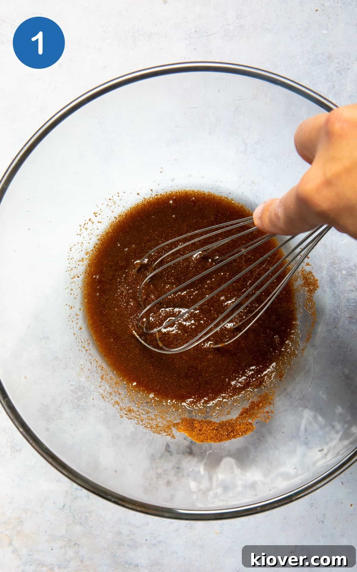 Vegan Lemon Drizzle Cake Recipe — Light Citrus Loaf 4 coconut oil and coconut sugar being whisked together in large mixing bowl.