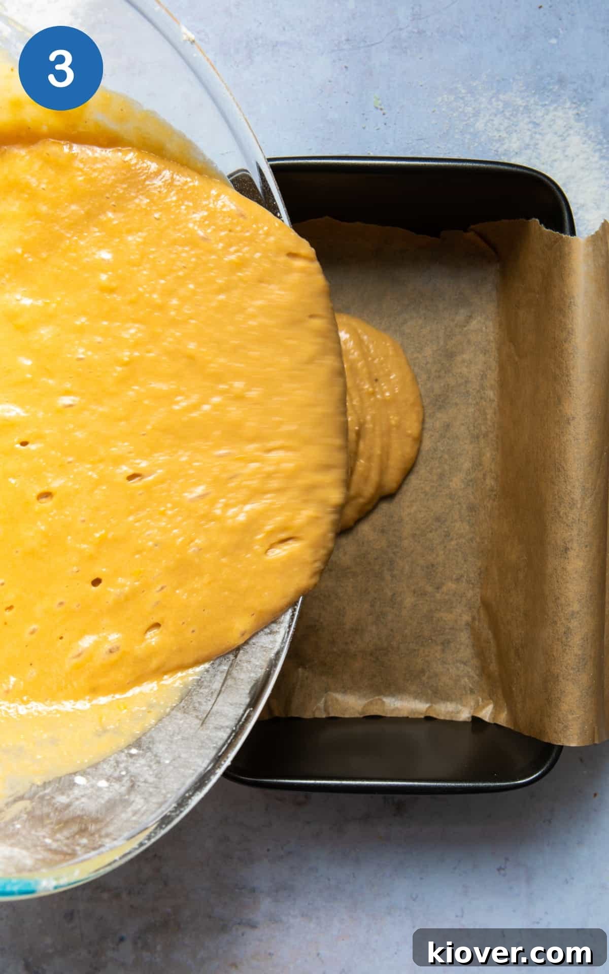 Vegan Lemon Drizzle Cake Recipe — Light Citrus Loaf 6 lemon drizzle batter being poured into loaf tin.