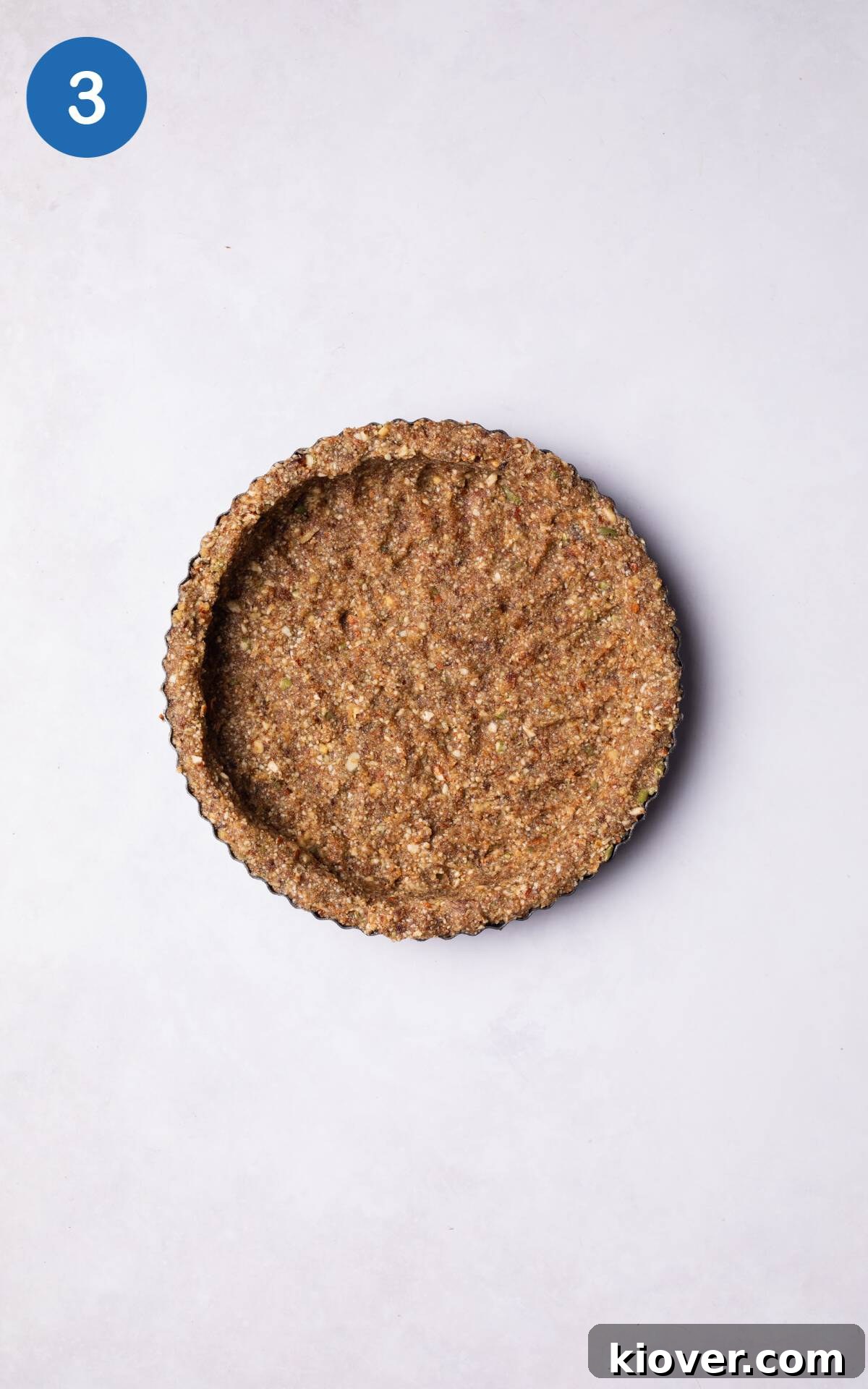 Base mixture for No Bake Pumpkin pie in a tart tin.