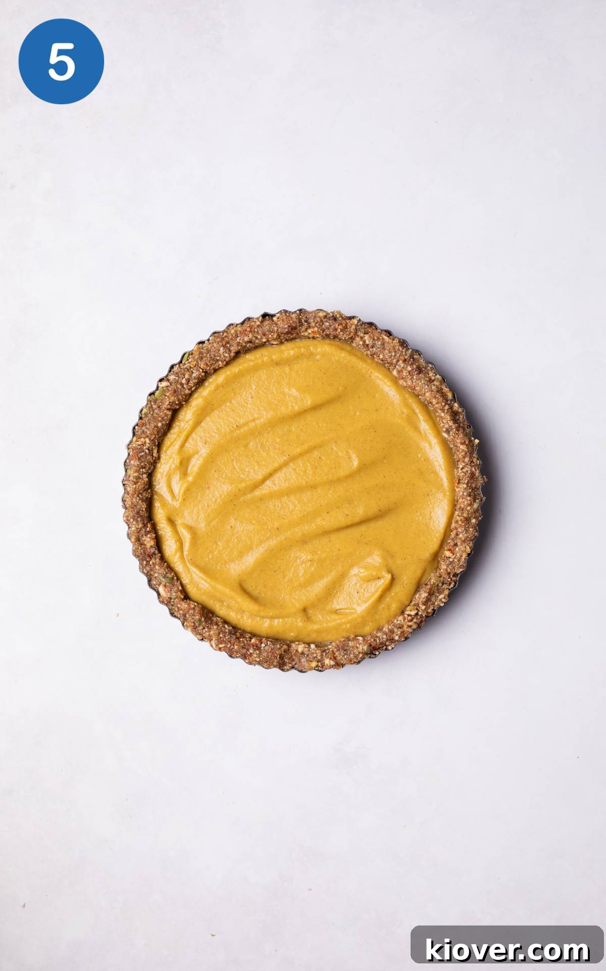 Pumpkin mix spread onto the base of No Bake Pumpkin pie.