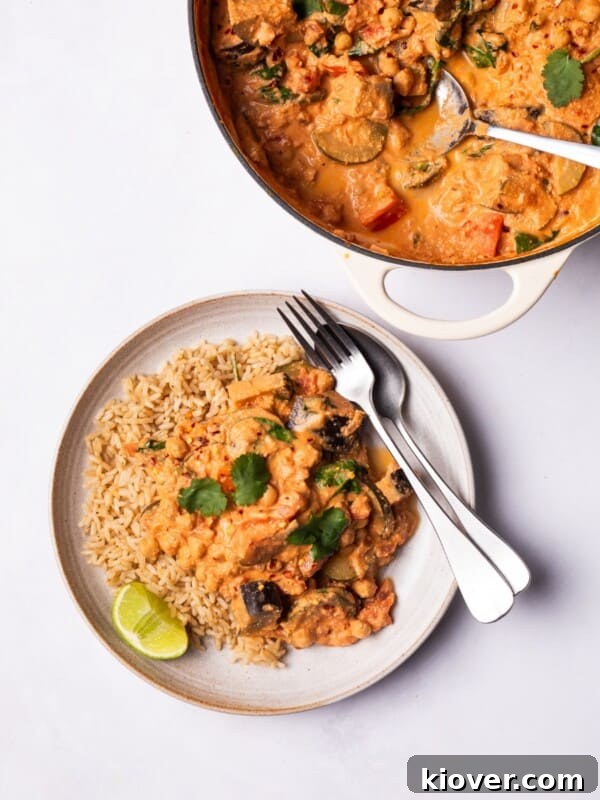 Colorful Vegetable Curry served on a plate with brown rice.