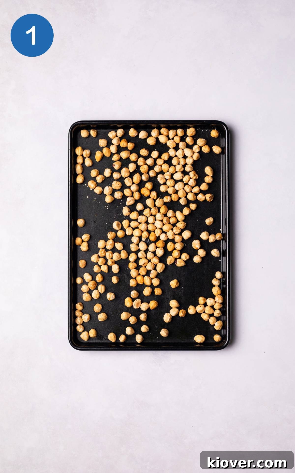 Hazelnuts on a baking tray.
