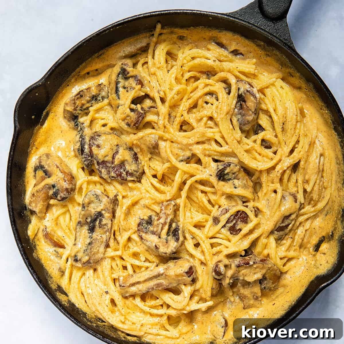 Creamy Mushroom Alfredo Pasta Recipe for Dinner 2 Mushroom Alfredo in a pan.